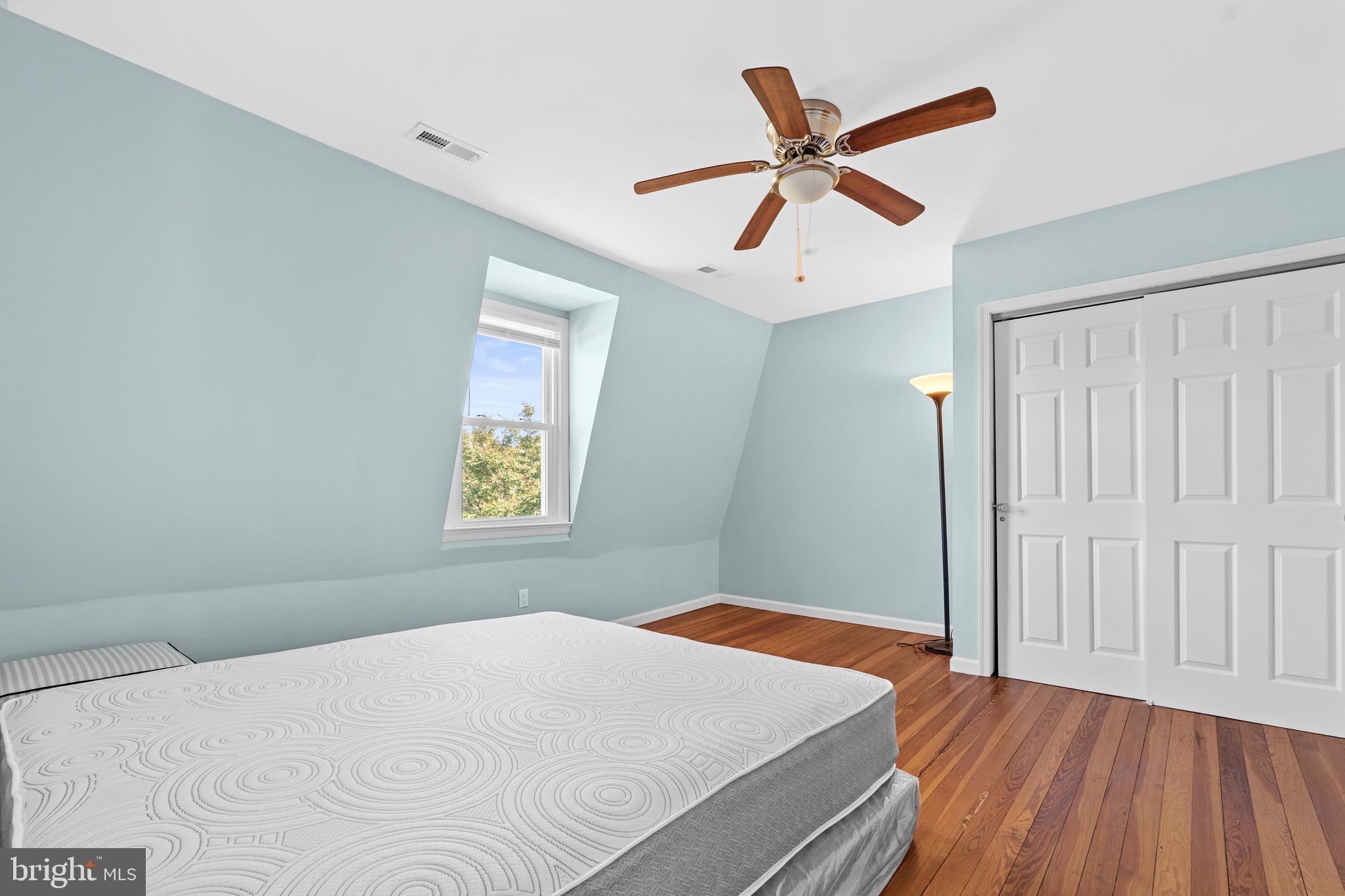17203 Piney Point Road Piney Point, MD 20674 - Photo 27 of 43 a bedroom with a large bed and a window