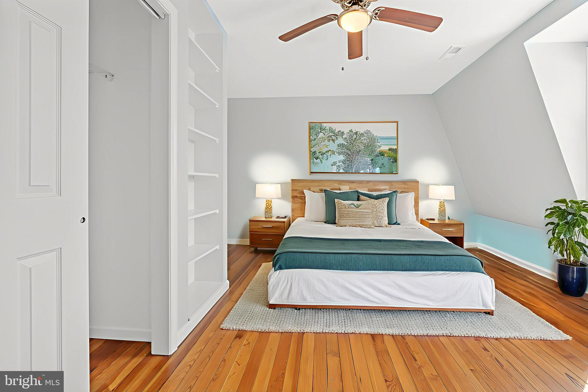 17203 Piney Point Road Piney Point, MD 20674 - Photo 30 of 43 a bedroom with a bed and wooden floor