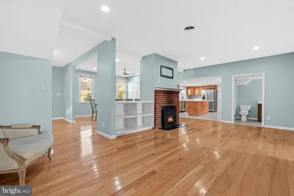a view of empty room with furniture and fireplace
