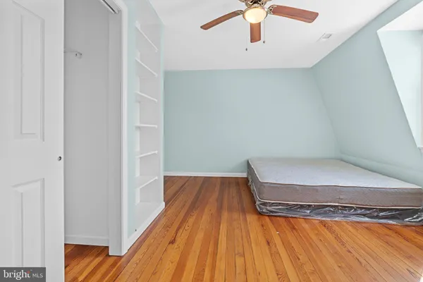 a view of a room with wooden floor