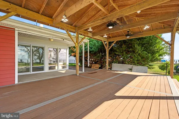 a swimming pool with large glass windows and painted walls