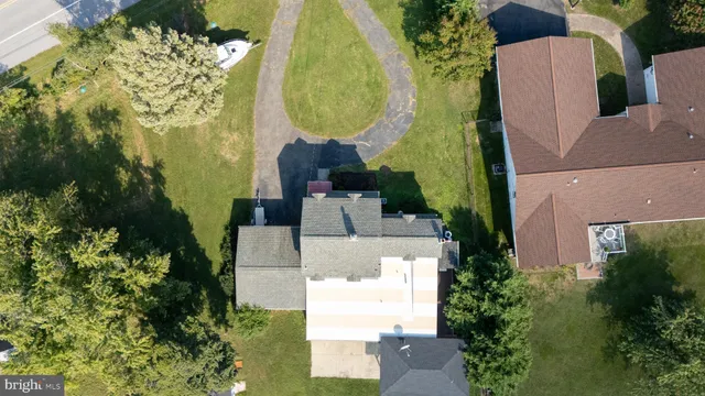 an aerial view of a house with swimming pool