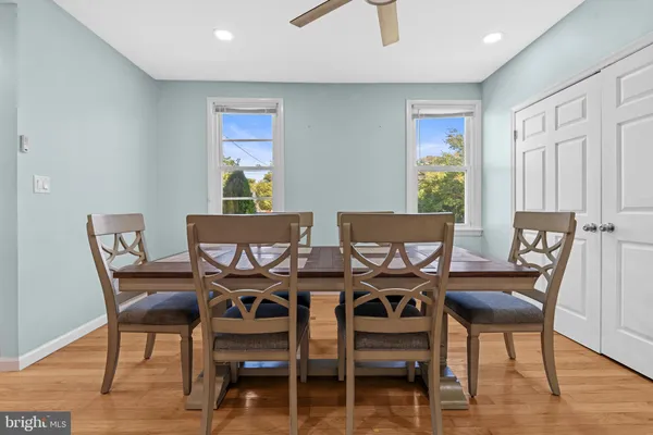 a view of a dining room with furniture window and wooden floor