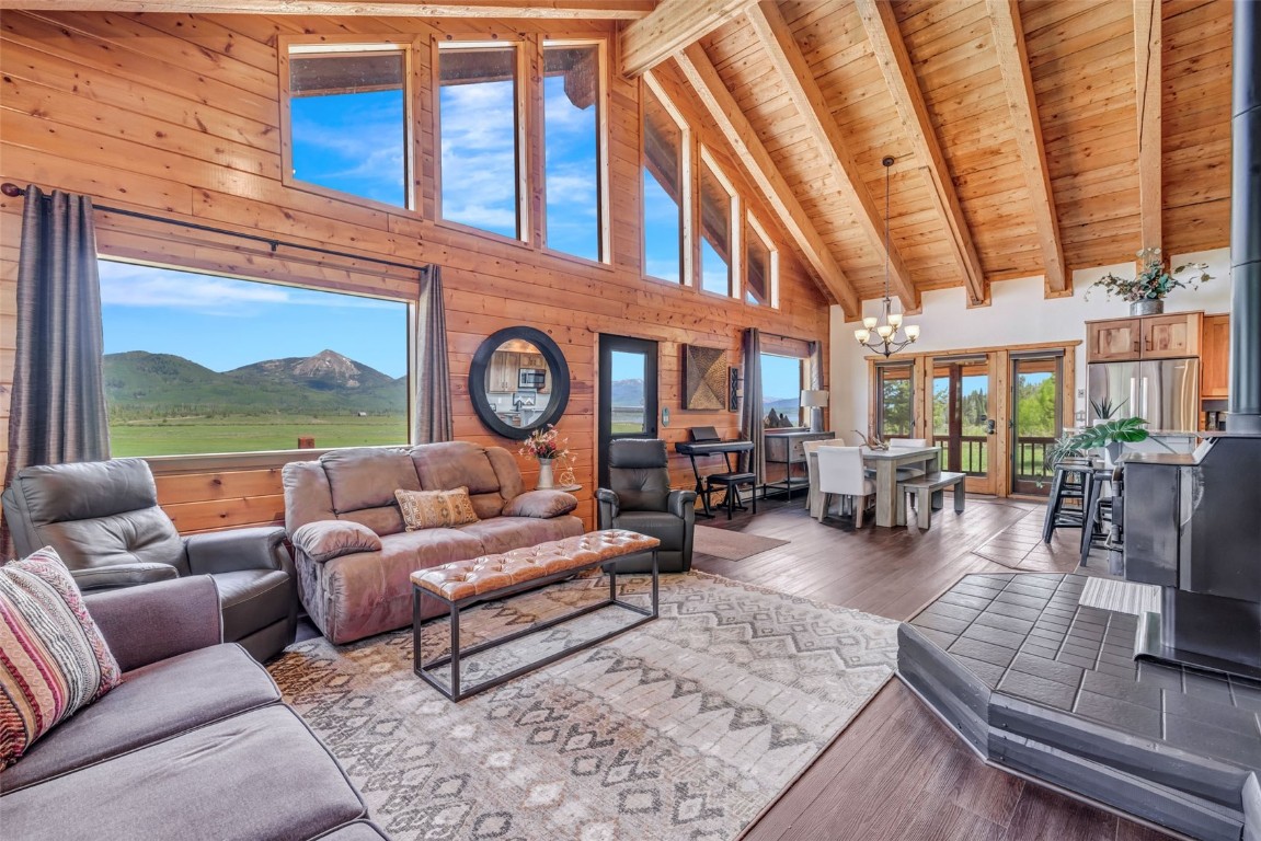 60455 Floyd Creek Road Clark, CO 80428 - Photo 17 of 50 a living room with furniture a rug and a large window