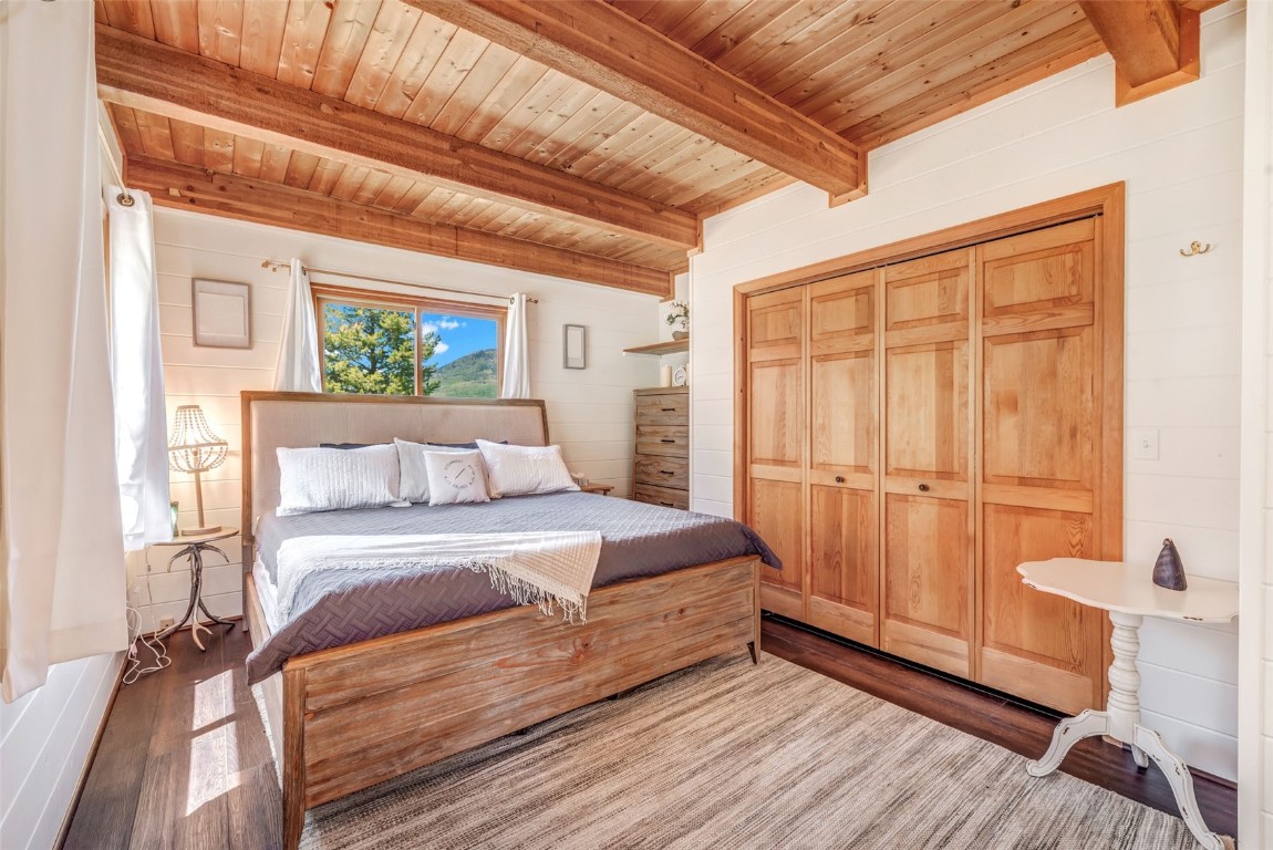 60455 Floyd Creek Road Clark, CO 80428 - Photo 19 of 50 a bedroom with a bed and a window