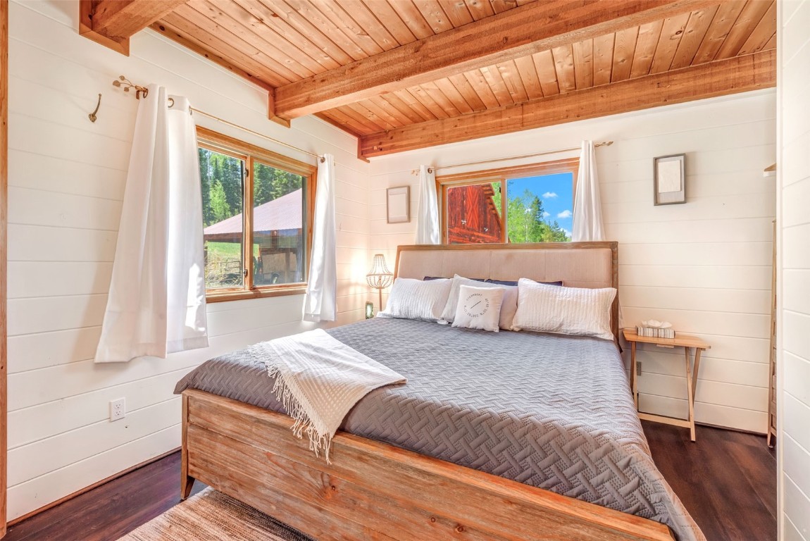 60455 Floyd Creek Road Clark, CO 80428 - Photo 20 of 50 a bed sitting in a bedroom next to a window