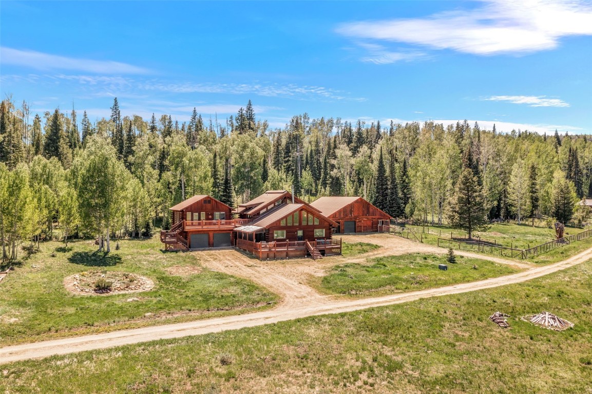 60455 Floyd Creek Road Clark, CO 80428 - Photo 2 of 50 a view of a swimming pool and trees in the background