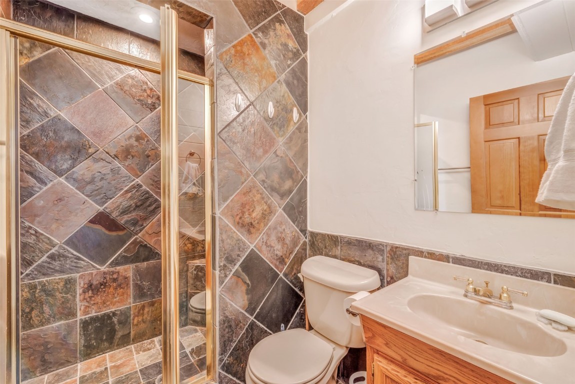 60455 Floyd Creek Road Clark, CO 80428 - Photo 23 of 50 a bathroom with a sink toilet and shower