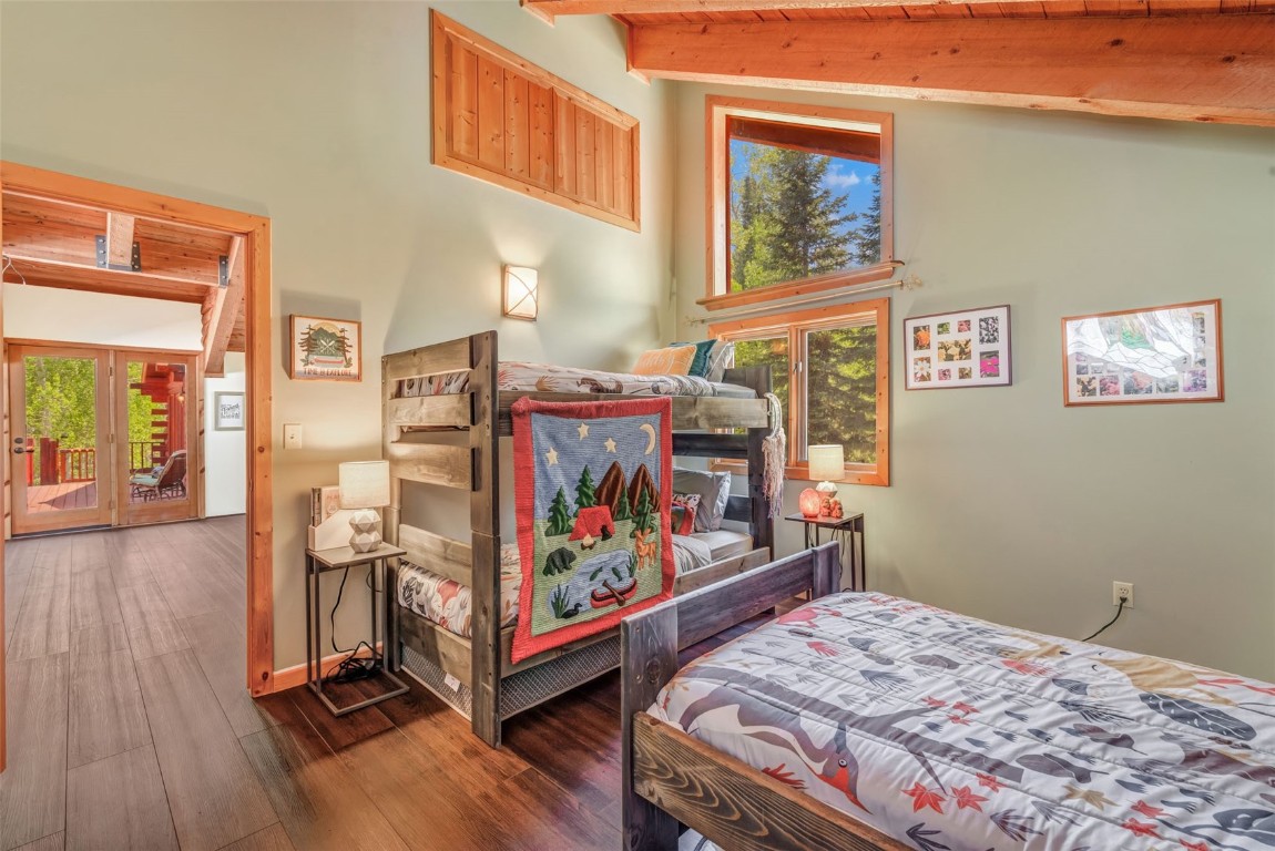 60455 Floyd Creek Road Clark, CO 80428 - Photo 29 of 50 a bed room with a bed and painting on the wall