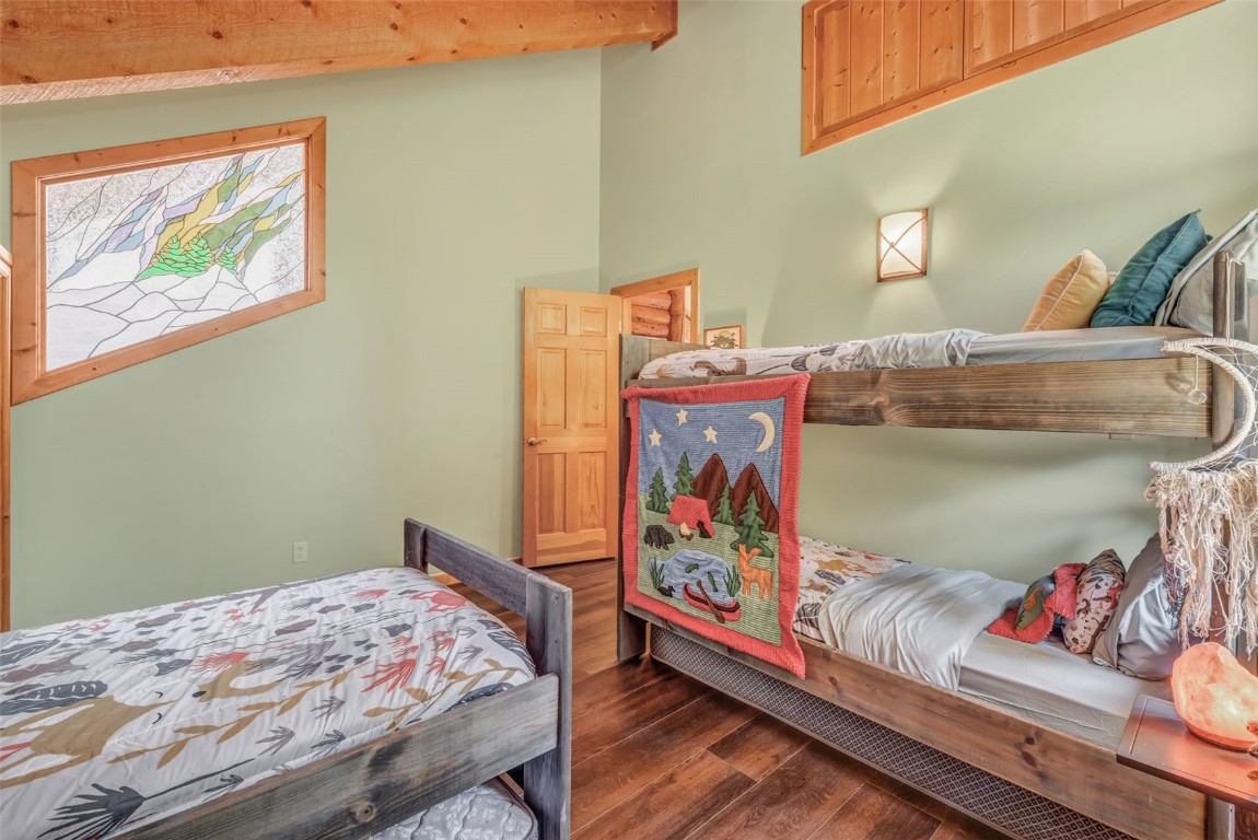 60455 Floyd Creek Road Clark, CO 80428 - Photo 30 of 50 a bedroom with bed and wooden floor