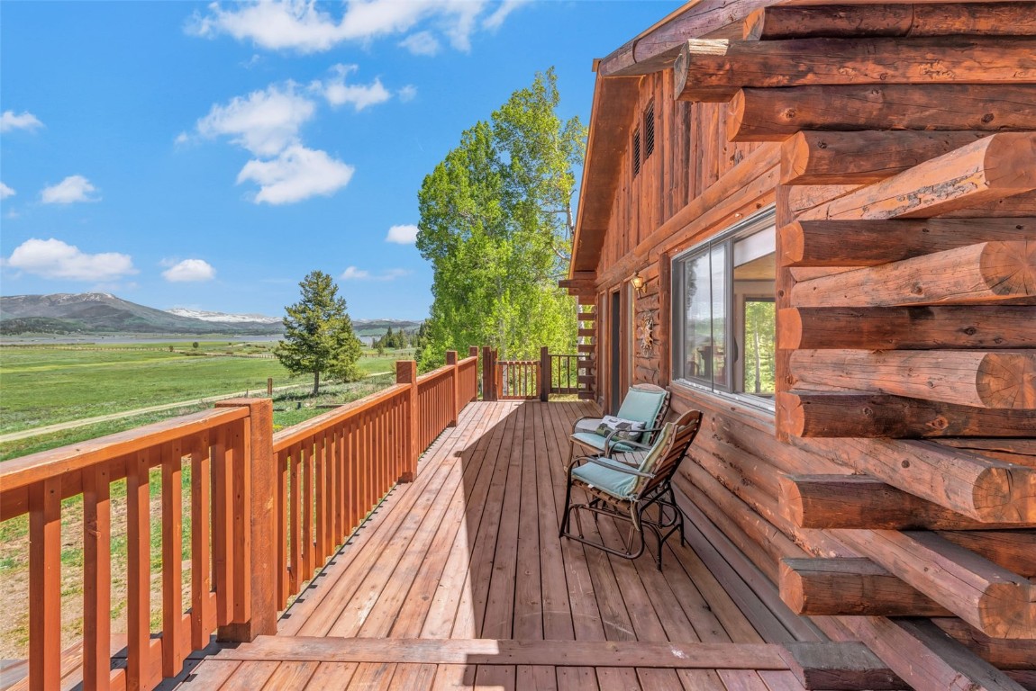 60455 Floyd Creek Road Clark, CO 80428 - Photo 35 of 50 a view of balcony with two chairs and a table