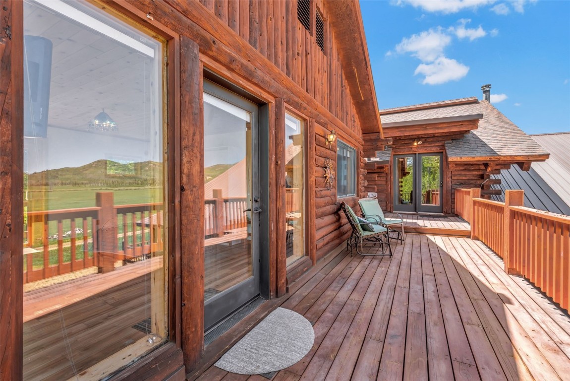 60455 Floyd Creek Road Clark, CO 80428 - Photo 36 of 50 a view of a balcony with wooden floor