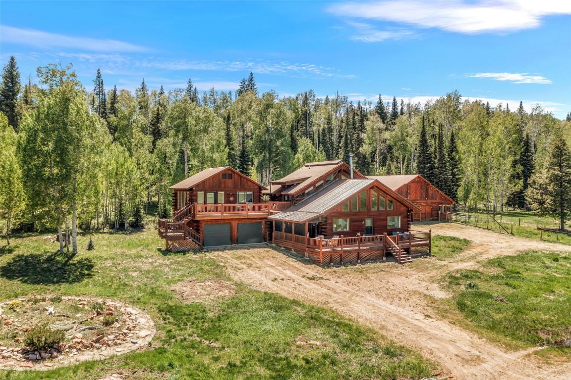 60455 Floyd Creek Road Clark, CO 80428 - Photo 4 of 50 a view of a house with garden and sitting area