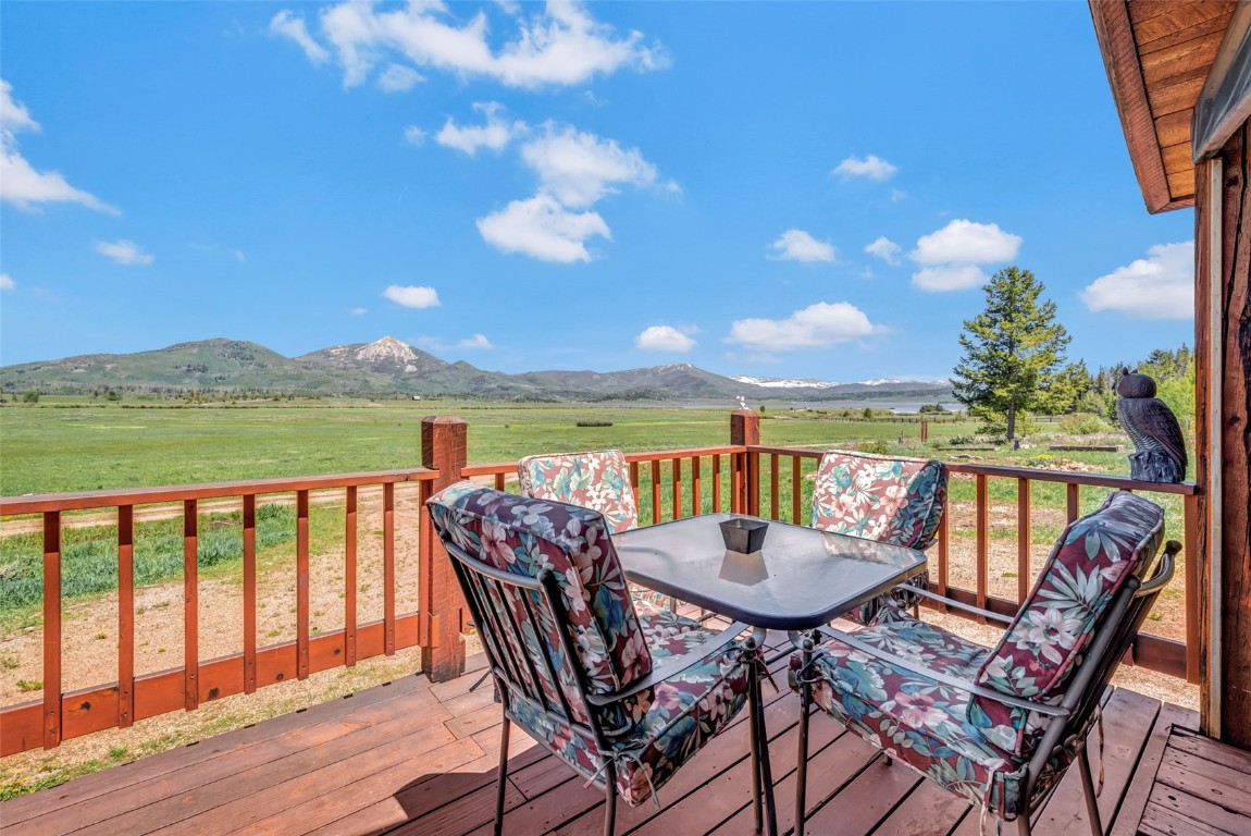 60455 Floyd Creek Road Clark, CO 80428 - Photo 44 of 50 a view of a chairs and table in the patio with a lake view