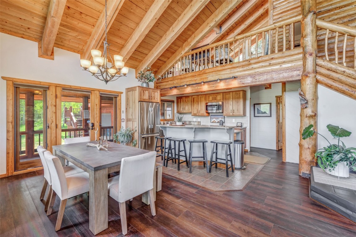 60455 Floyd Creek Road Clark, CO 80428 - Photo 7 of 50 a view of a dining room with furniture window and wooden floor