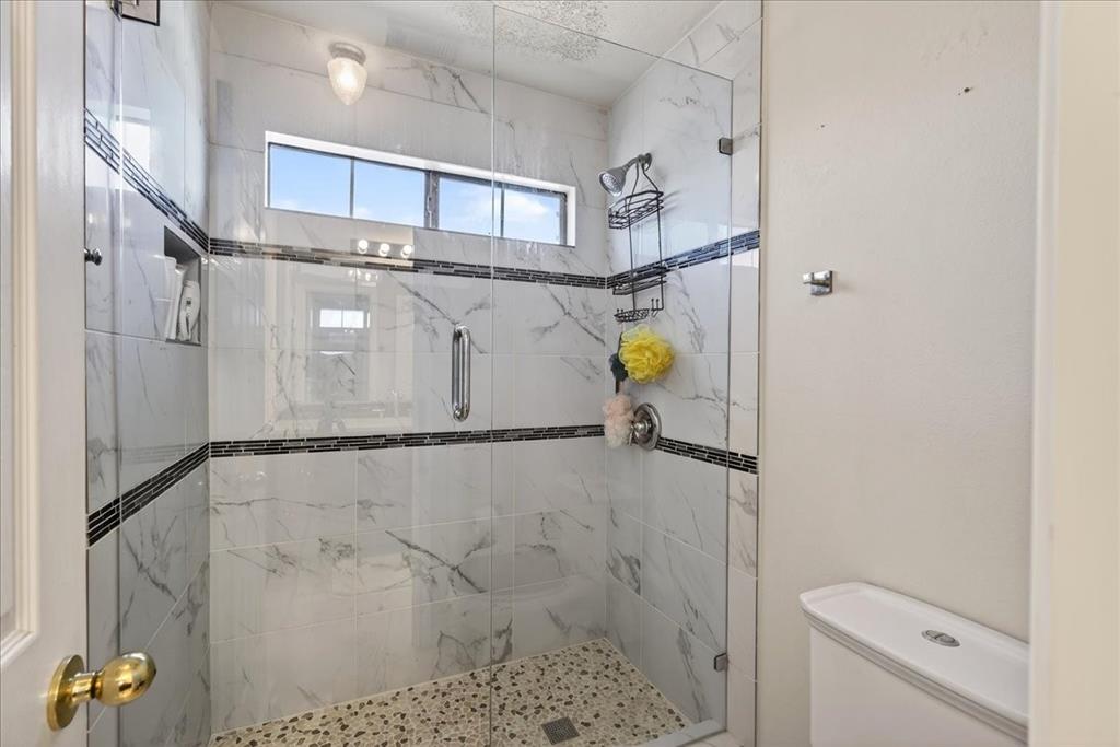 7308 Hawk Lane Sachse, TX 75048 - Photo 28 of 37 a bathroom with a sink and toilet