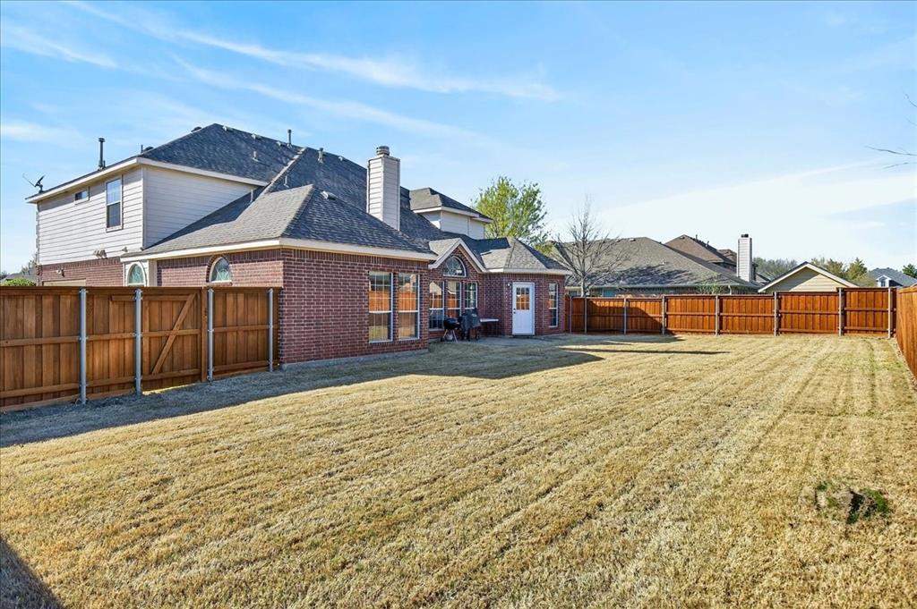 7308 Hawk Lane Sachse, TX 75048 - Photo 34 of 37 a front view of a house with a yard