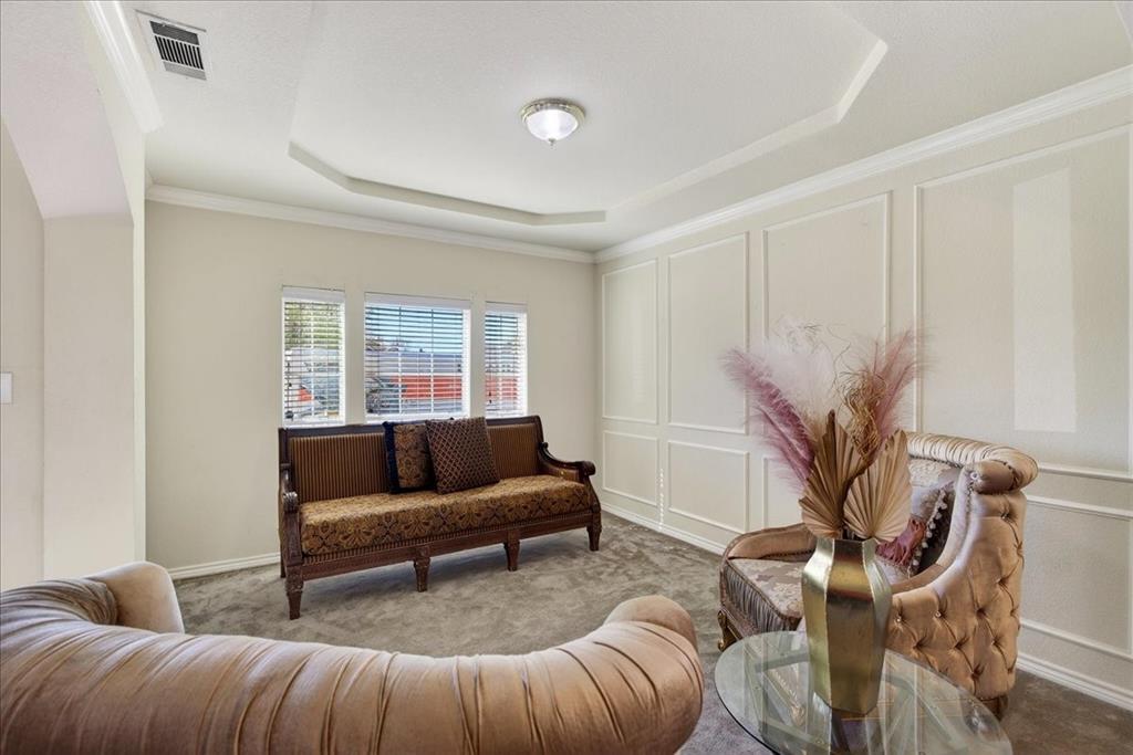 7308 Hawk Lane Sachse, TX 75048 - Photo 5 of 37 a living room with furniture and a potted plant