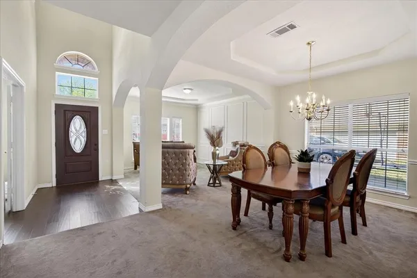 a view of a dining room with furniture window and outside view