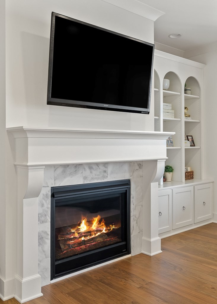 2311 Boyd Farris Road Cookeville, TN 38506 - Photo 13 of 74 a living room with a fireplace and a flat screen tv