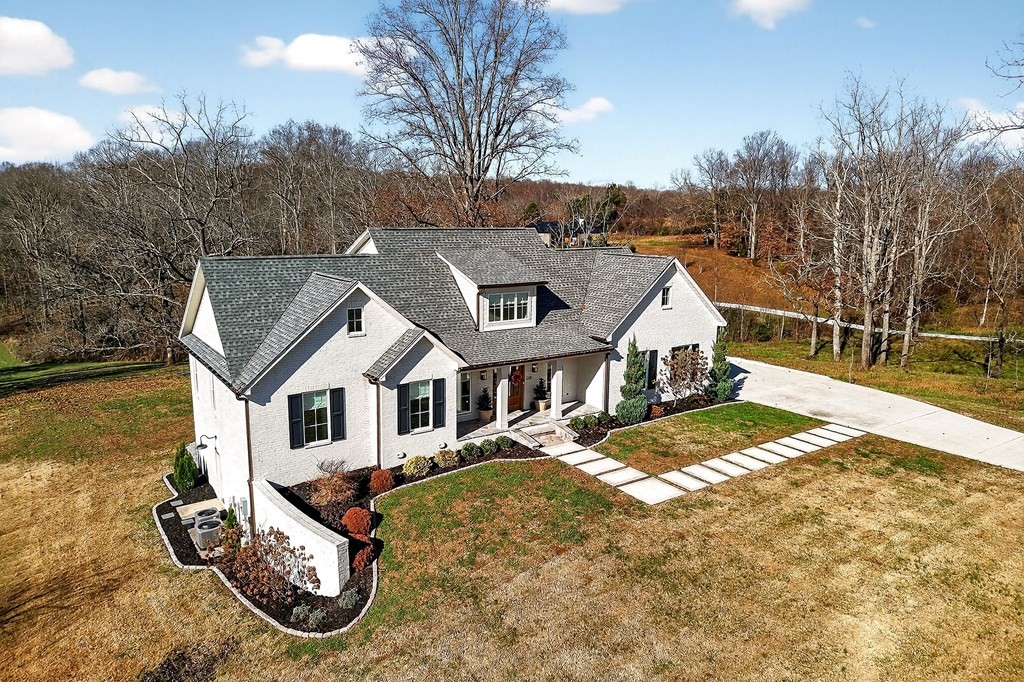 2311 Boyd Farris Road Cookeville, TN 38506 - Photo 2 of 74 a view of a white house next to a yard with a large tree