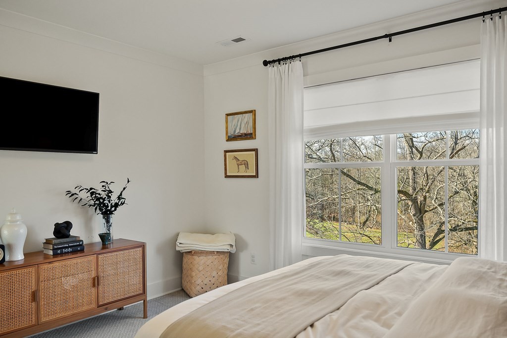 2311 Boyd Farris Road Cookeville, TN 38506 - Photo 31 of 74 a bedroom with a bed and a flat screen tv