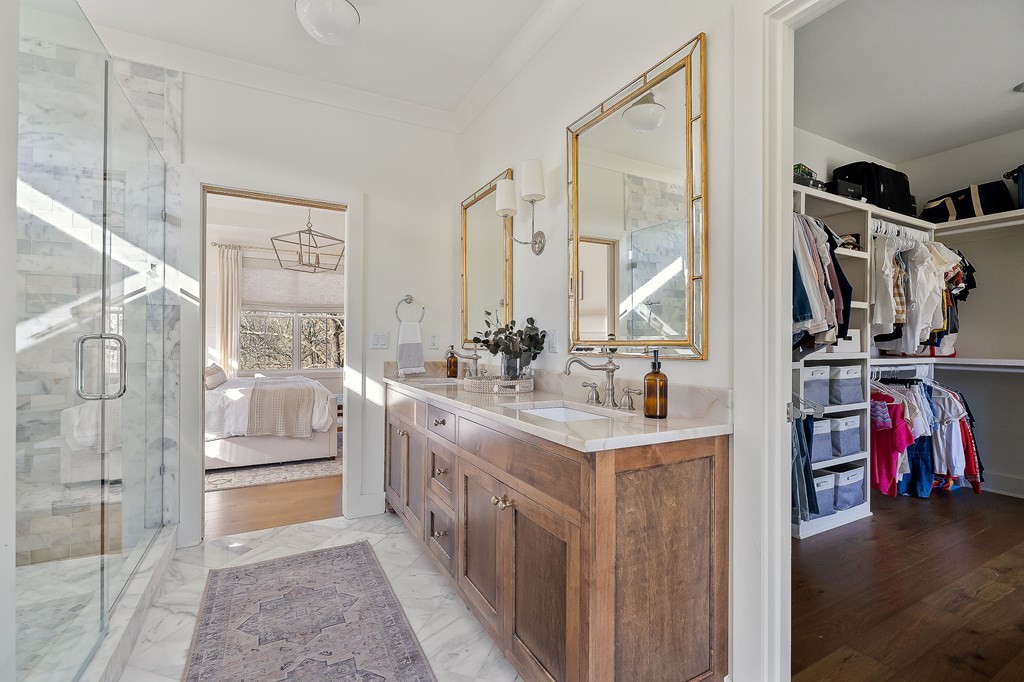 2311 Boyd Farris Road Cookeville, TN 38506 - Photo 39 of 74 a bathroom with a double vanity sink and a mirror