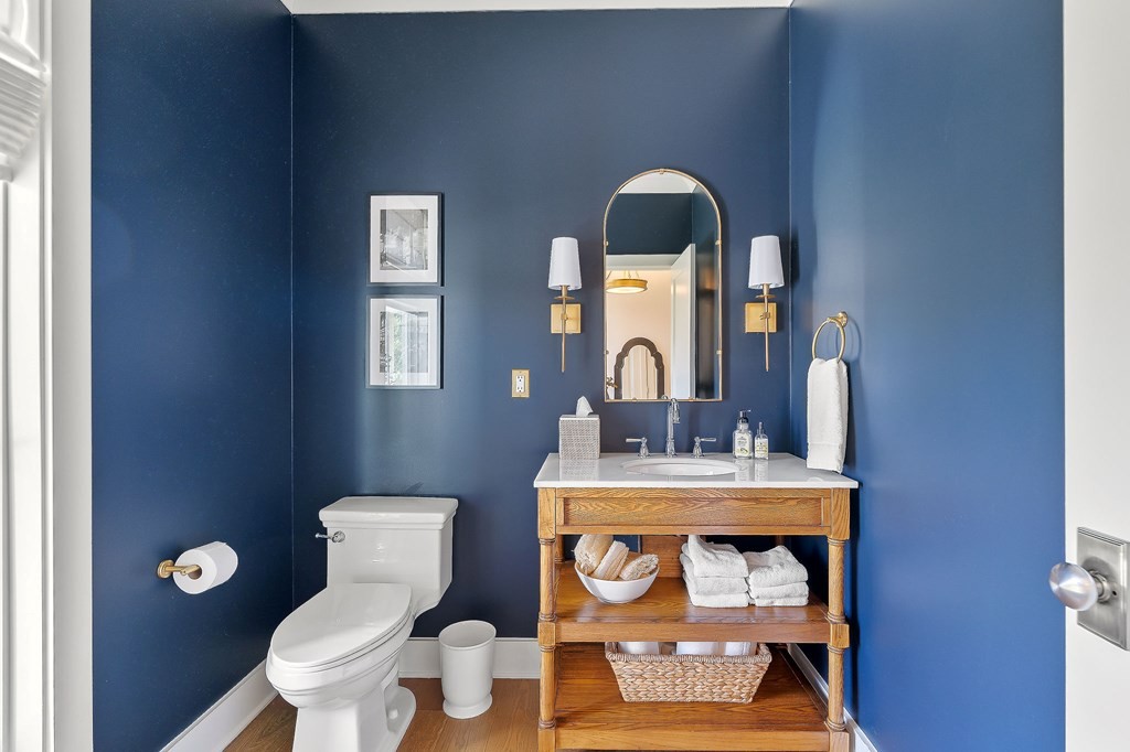 2311 Boyd Farris Road Cookeville, TN 38506 - Photo 45 of 74 a bathroom with a toilet sink vanity mirror and vanity
