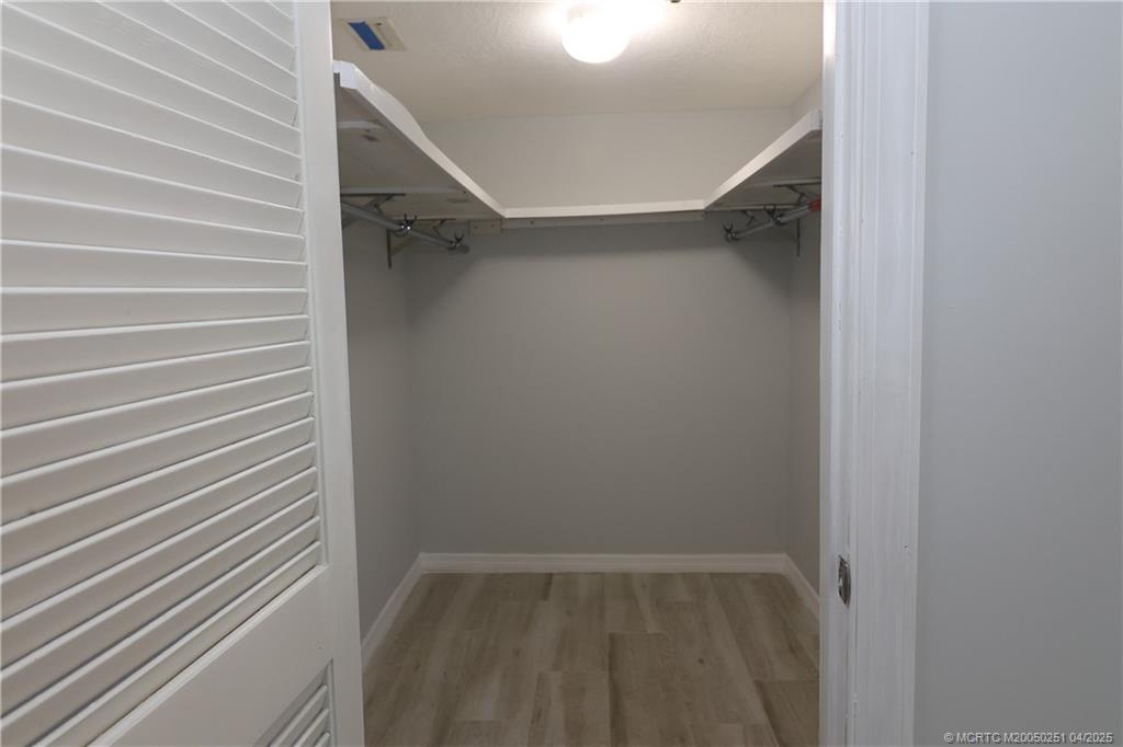 2950 Southeast Ocean Boulevard, Unit 101 Stuart, FL 34996 - Photo 19 of 35 a view of hallway with shower