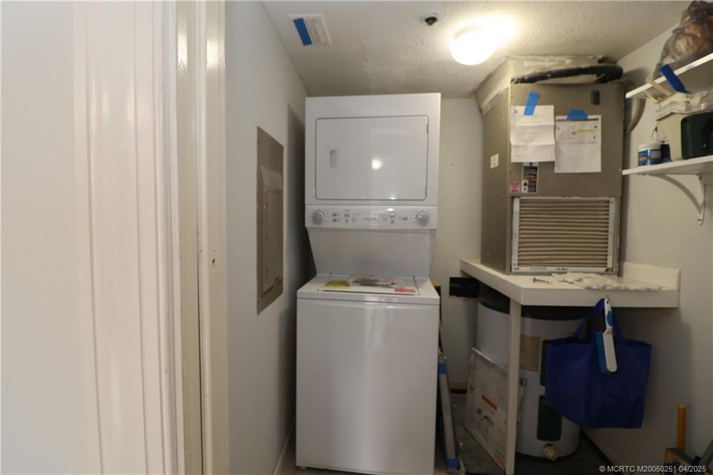 2950 Southeast Ocean Boulevard, Unit 101 Stuart, FL 34996 - Photo 26 of 35 a utility room with dryer and washer