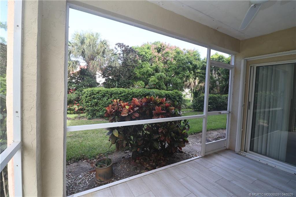 2950 Southeast Ocean Boulevard, Unit 101 Stuart, FL 34996 - Photo 28 of 35 a view of a room with wooden floor and outdoor view