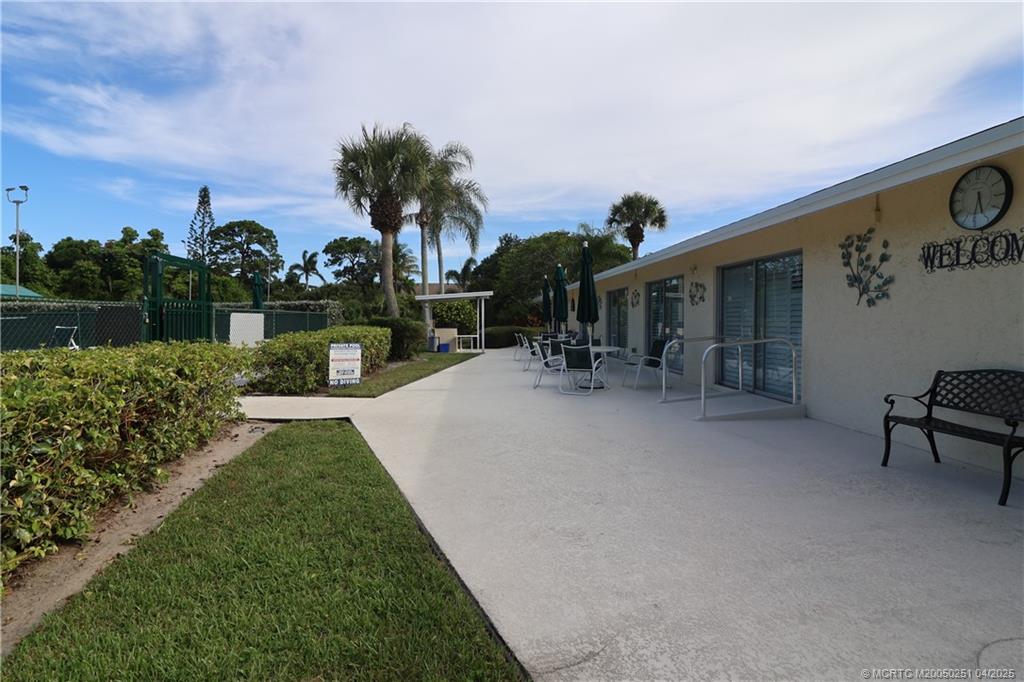 2950 Southeast Ocean Boulevard, Unit 101 Stuart, FL 34996 - Photo 31 of 35 a view of a park with plants and a lake view
