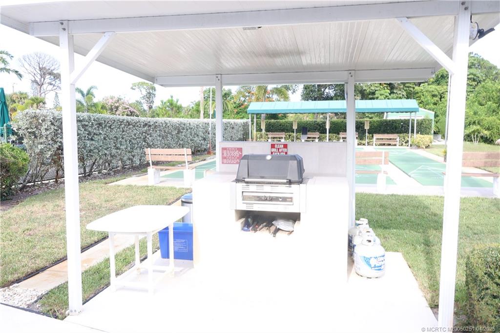 2950 Southeast Ocean Boulevard, Unit 101 Stuart, FL 34996 - Photo 34 of 35 a view of a swimming pool with a patio