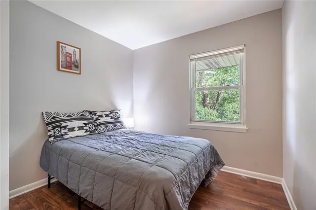 a bedroom with bed and window