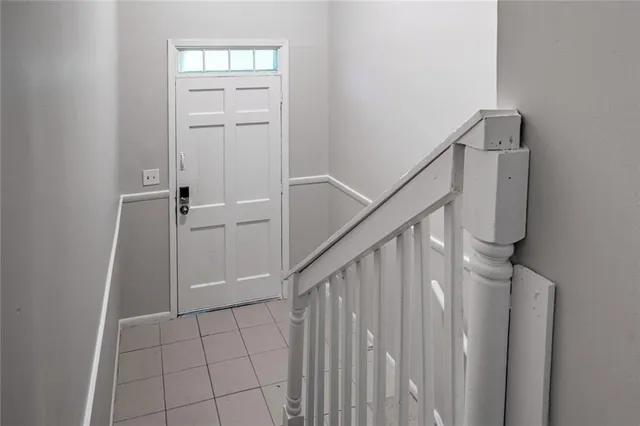 a view of an entryway with wooden floor