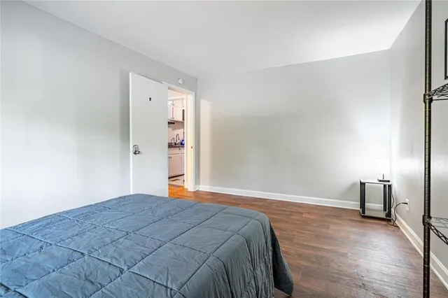 a bedroom with a bed and a table