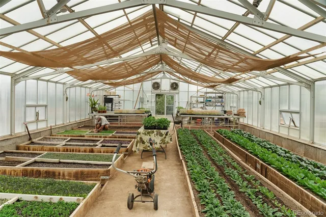 a view of a backyard with sitting area
