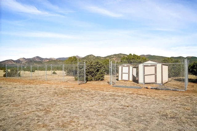 a big house with a big yard and large trees