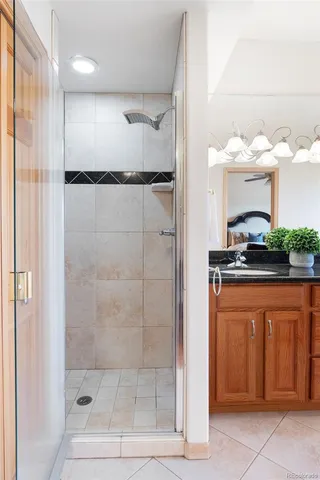 a bathroom with a shower and a sink