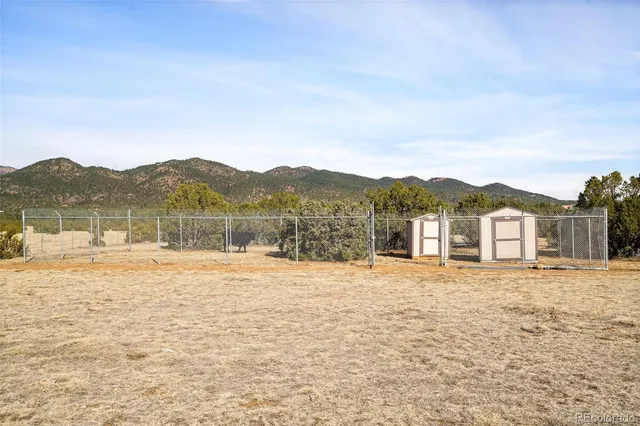 a view of an ocean with a mountain in the background