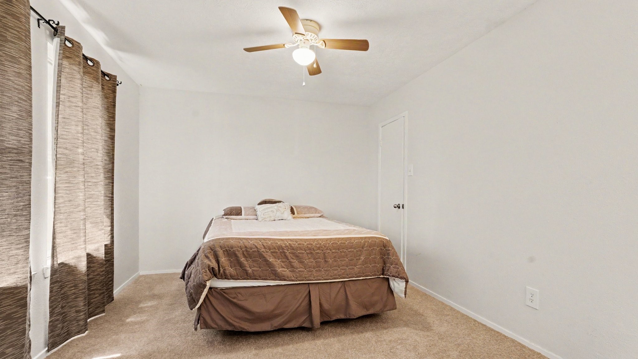 1506 Holbech Lane Channelview, TX 77530 - Photo 18 of 21 a bedroom with a bed and a window
