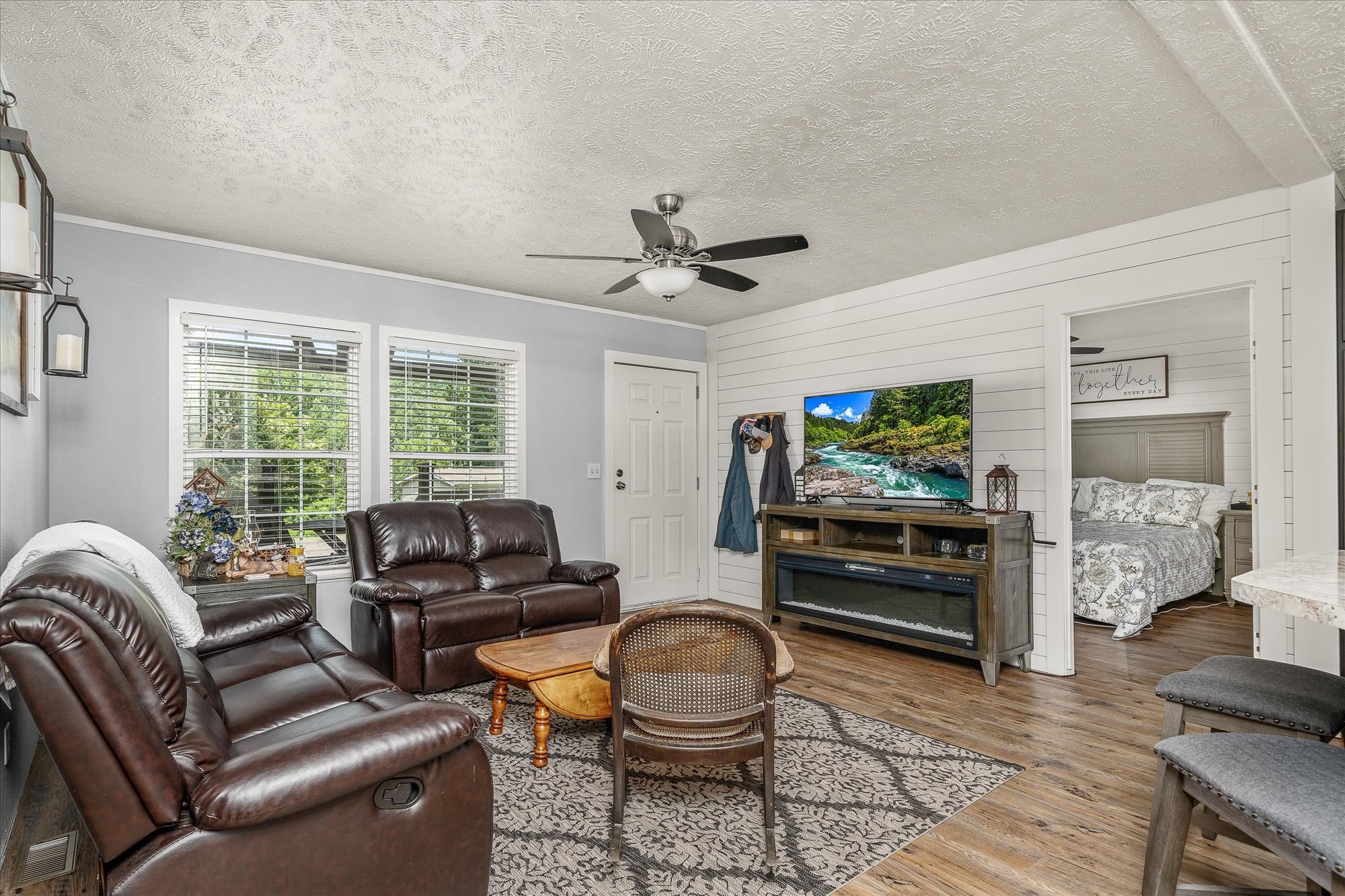 2025 Shiloh Road Decatur, TN 37322 - Photo 11 of 21 a living room with furniture a flat screen tv and a large window