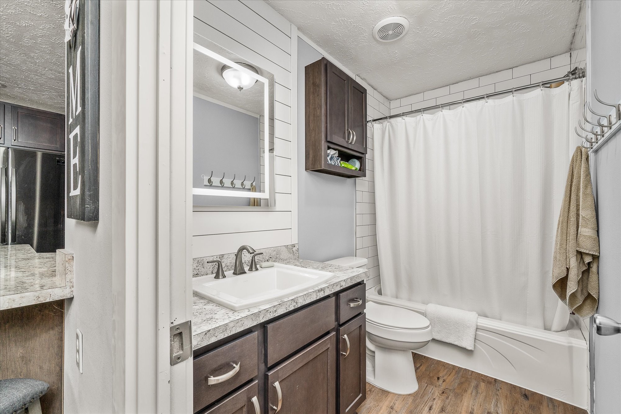 2025 Shiloh Road Decatur, TN 37322 - Photo 12 of 21 a bathroom with a granite countertop sink toilet and shower