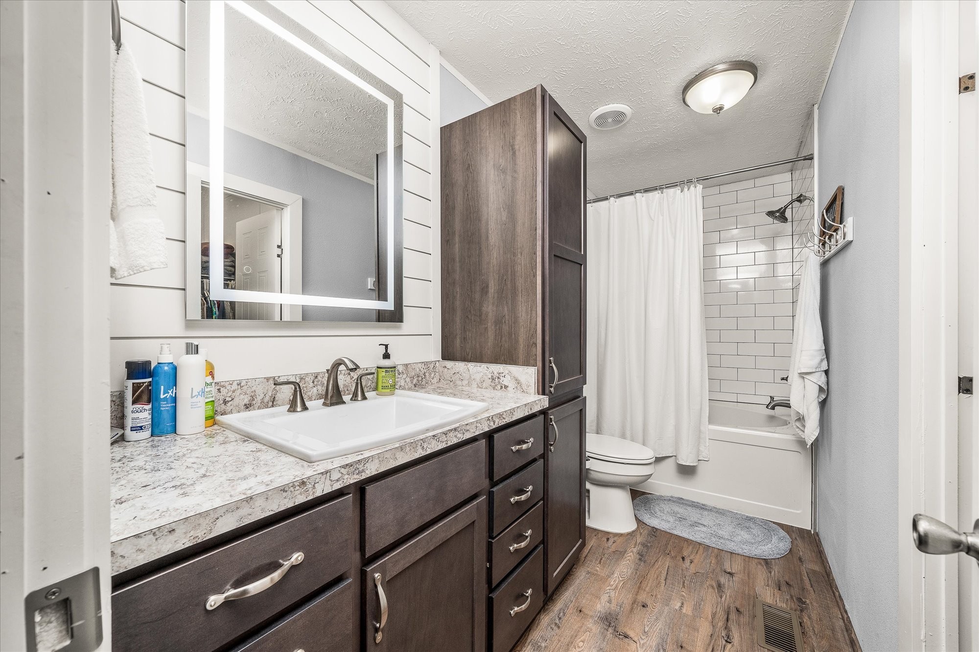 2025 Shiloh Road Decatur, TN 37322 - Photo 16 of 21 a bathroom with a granite countertop sink toilet and shower