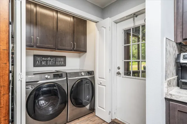 a view of a kitchen with washer and dryer