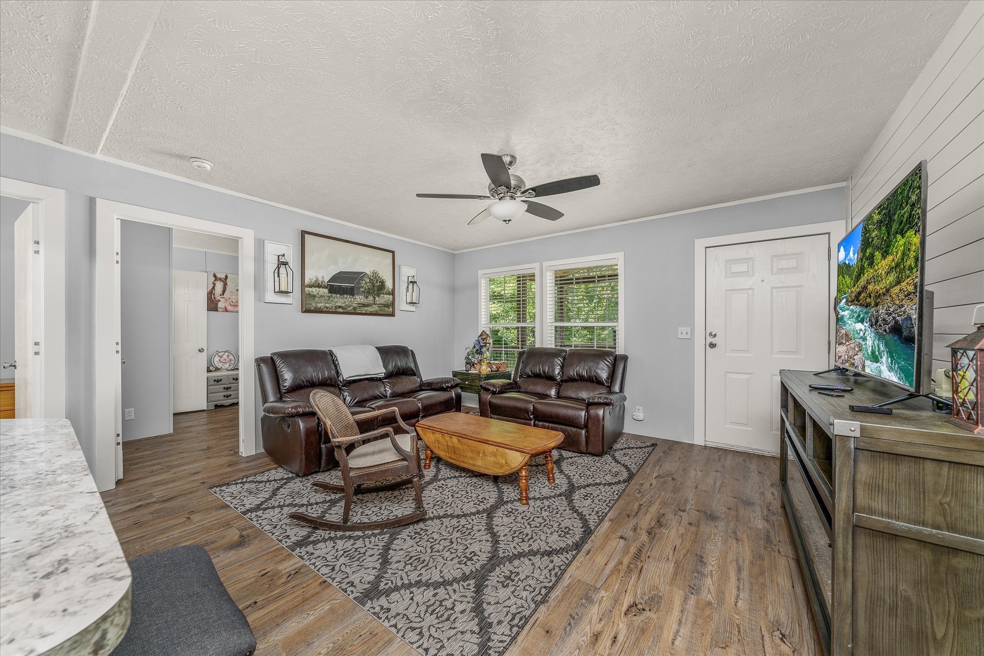 2025 Shiloh Road Decatur, TN 37322 - Photo 10 of 21 a living room with furniture a window and a flat screen tv