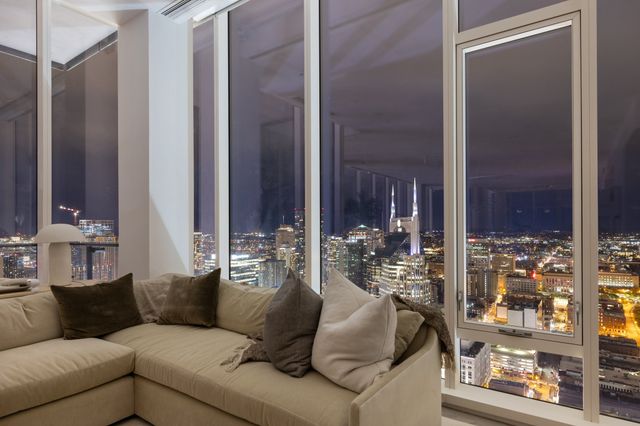 a view of a livingroom with furniture and front door