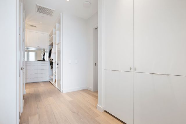 a bathroom with a shower and a sink