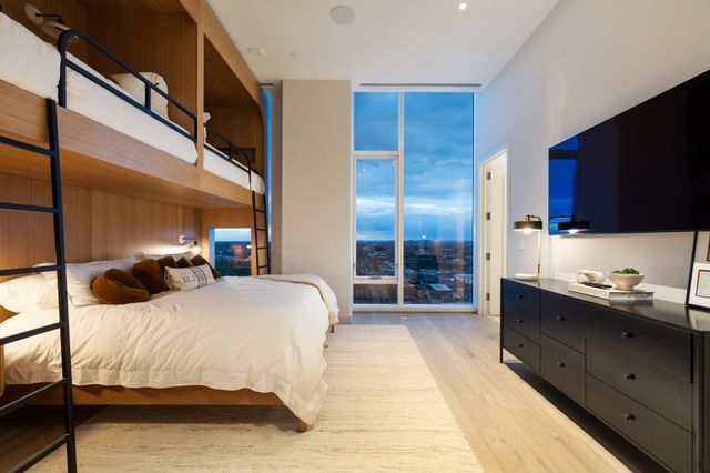 a bathroom with a double vanity sink toilet and shower