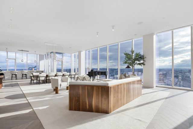 a dinning area with a table chairs and kitchen view